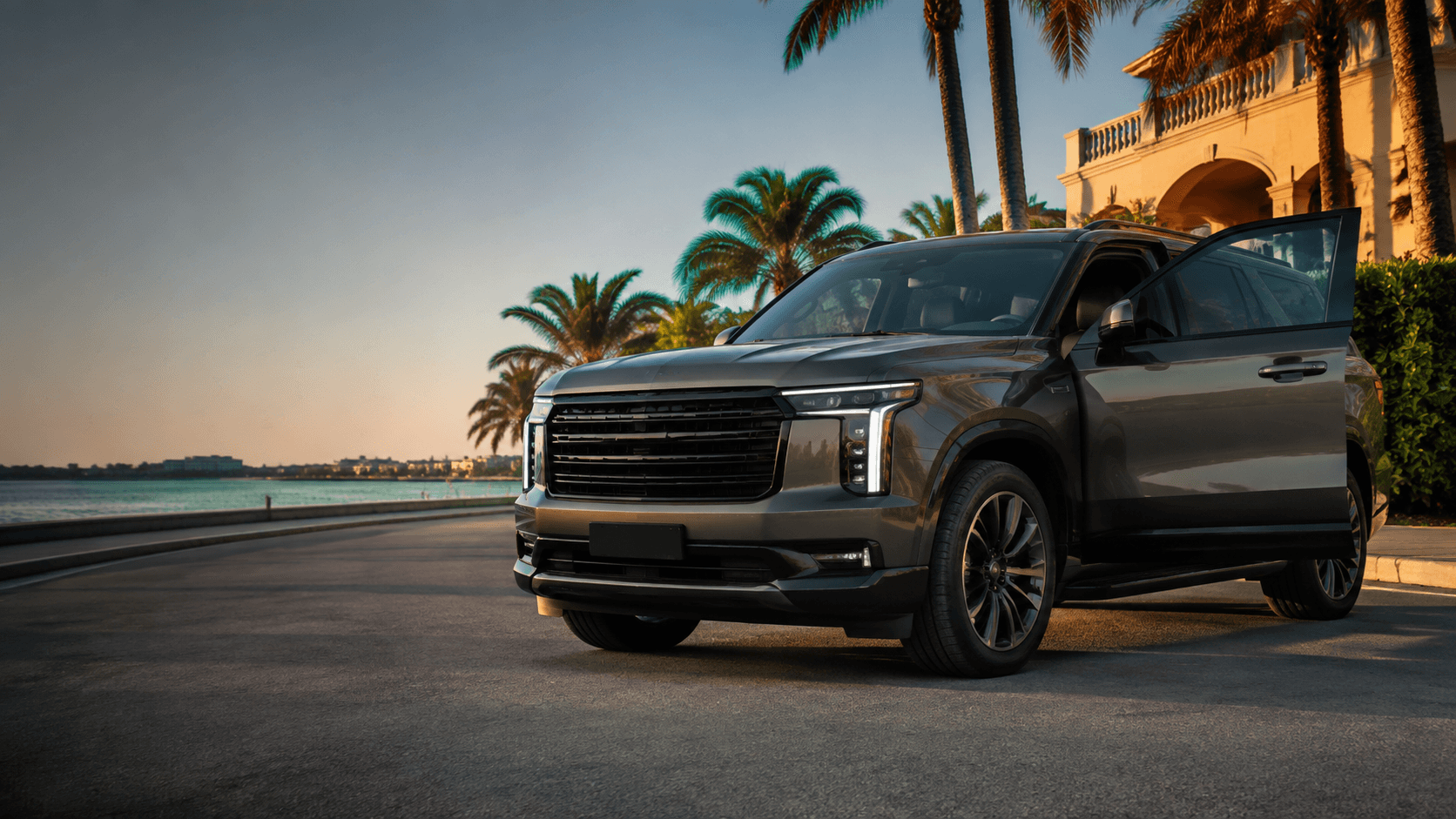 Silver full-size SUV parked on a palm-lined Sarasota street